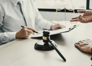 Shook & Fletcher Asbestos Trust Payments & Lawsuits 2 Asbestos attorney reviewing Shook & Fletcher trust claim documentation with client.