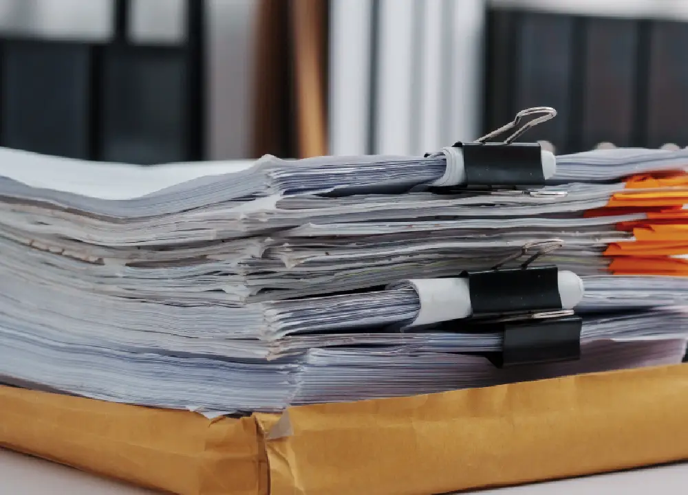 Stacked legal documents related to asbestos trust fund claims