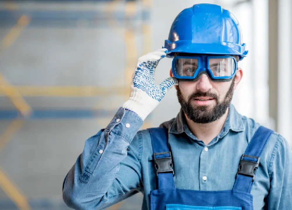 Construction worker in PPE to prevent asbestos exposure