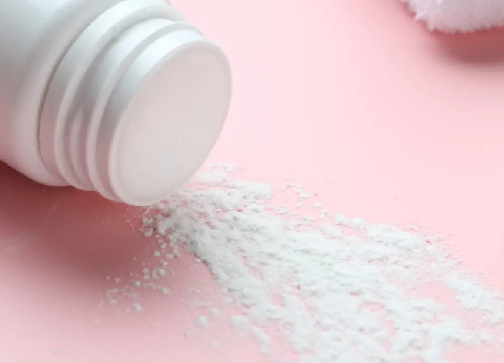 The Connection Between Talc and Asbestos: Protect Your Health 2 Baby powder container representing talc-based personal care products.