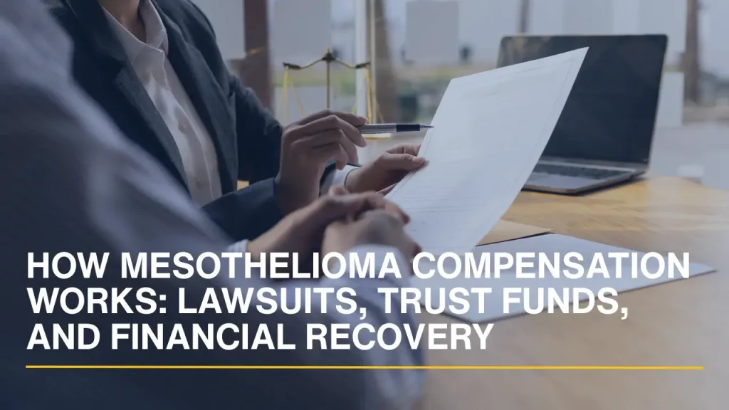 Lawyer reviewing compensation-related documents with a client during a legal consultation.