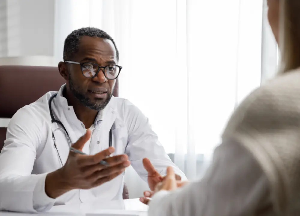 Doctor consulting with a patient about a medical diagnosis and next steps.