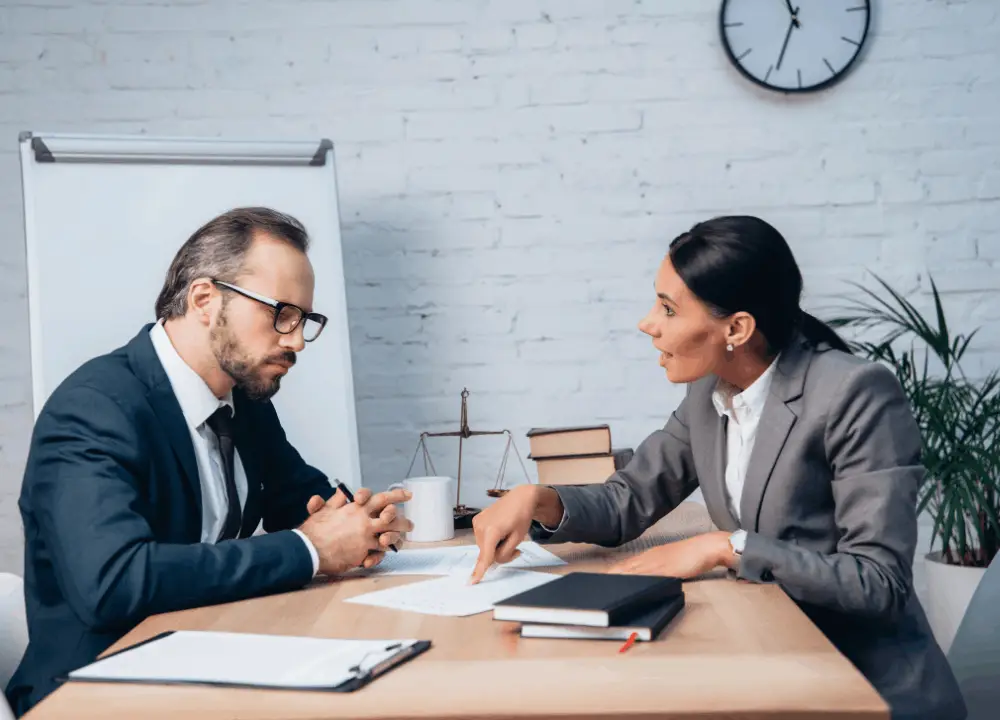 Essential Guide to Asbestos: Risks and Legal Options for Beginners 3 Compassionate asbestos attorney explaining legal options to a client
