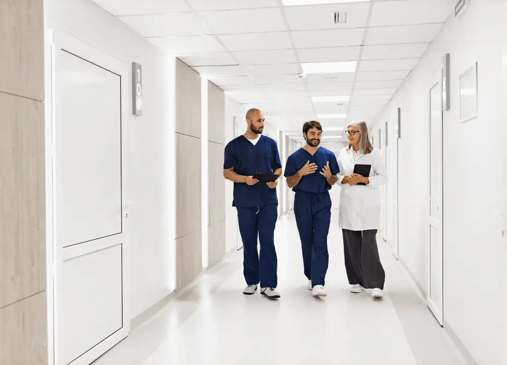 Medical team walking together in a hospital specializing in cancer care