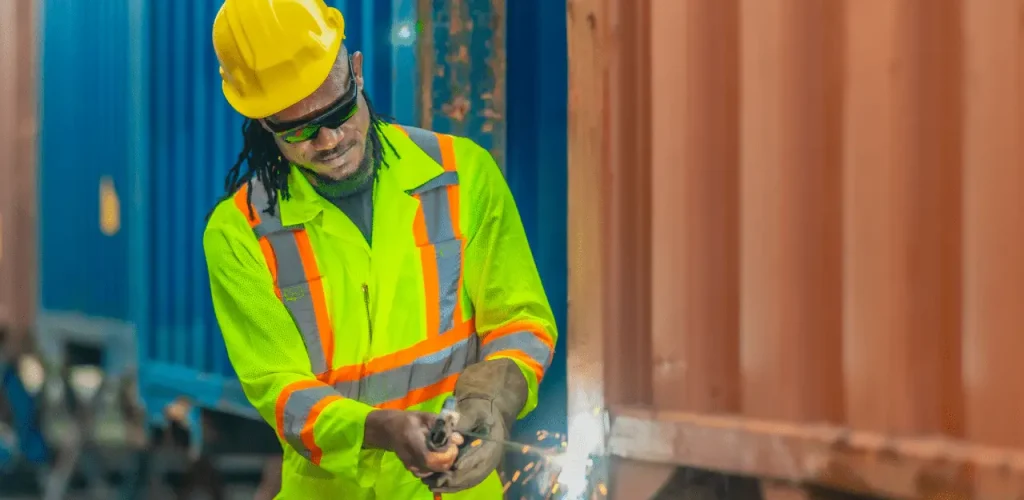 Shipyard worker in safety gear reducing Asbestos Exposure